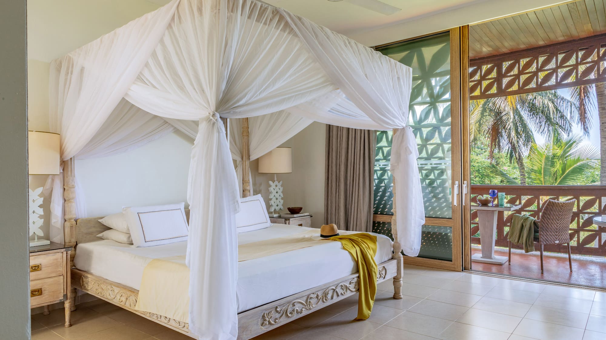 a white canopy bed in a room