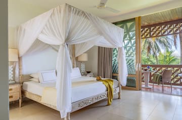 a white canopy bed in a room
