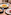 a table with plates of food and a glass of wine