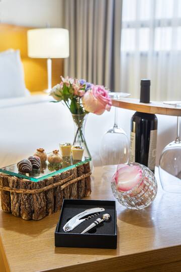a table with wine glasses and a bottle of wine and a glass of wine