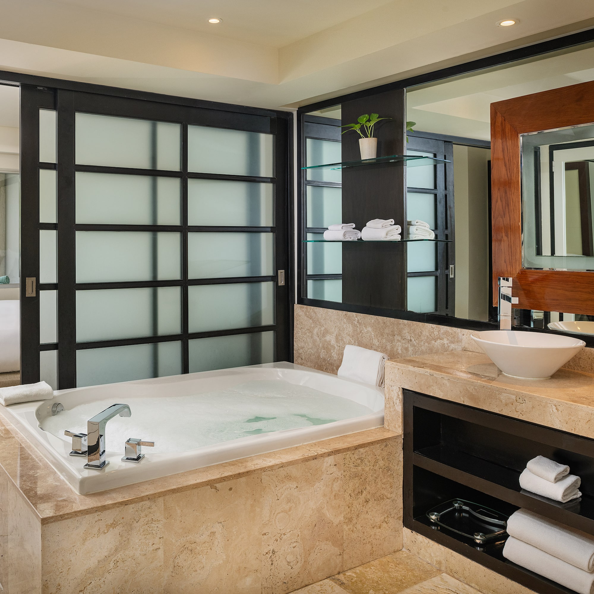 a bathroom with a tub and sink