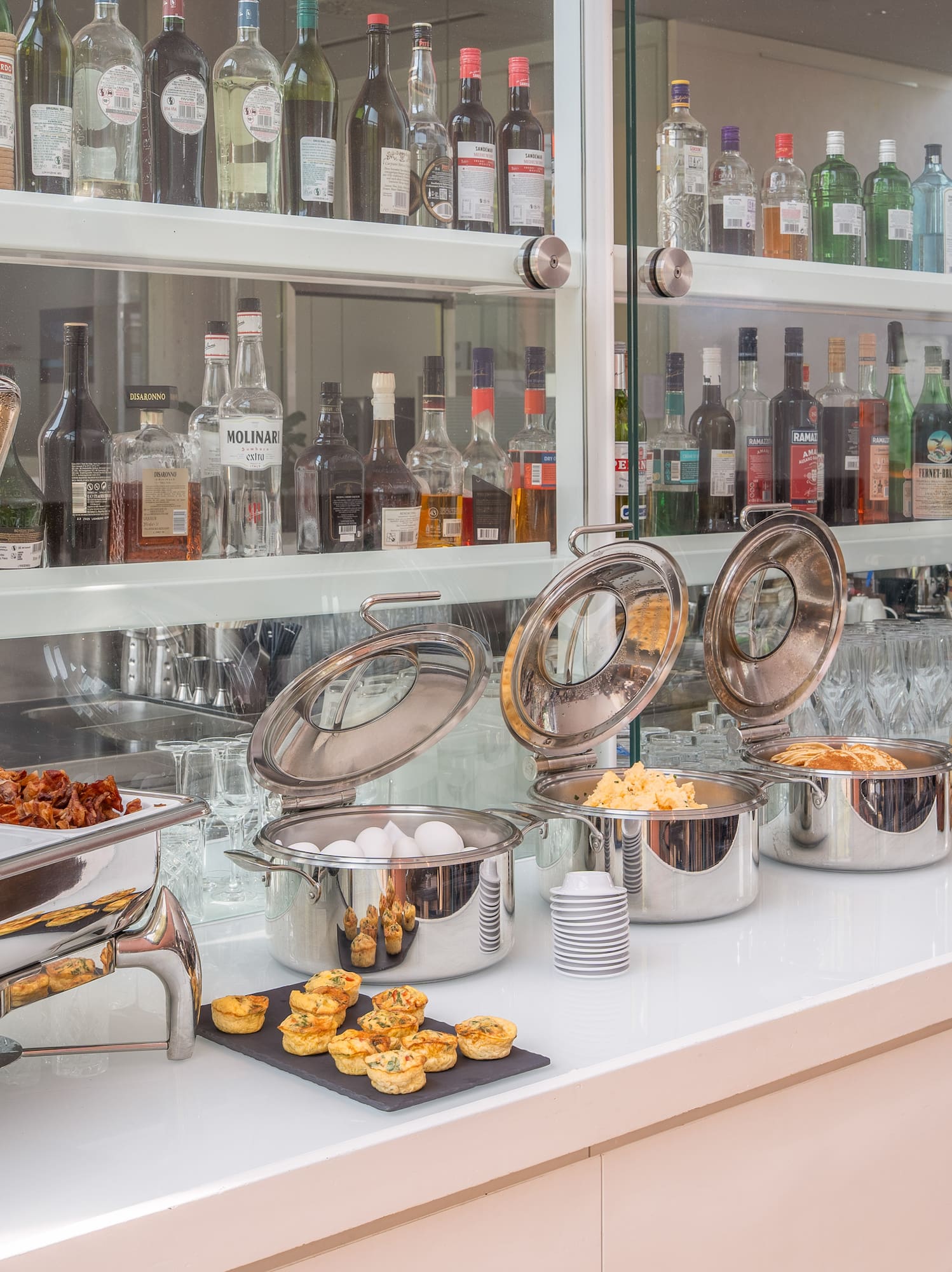 a buffet table with food and drinks