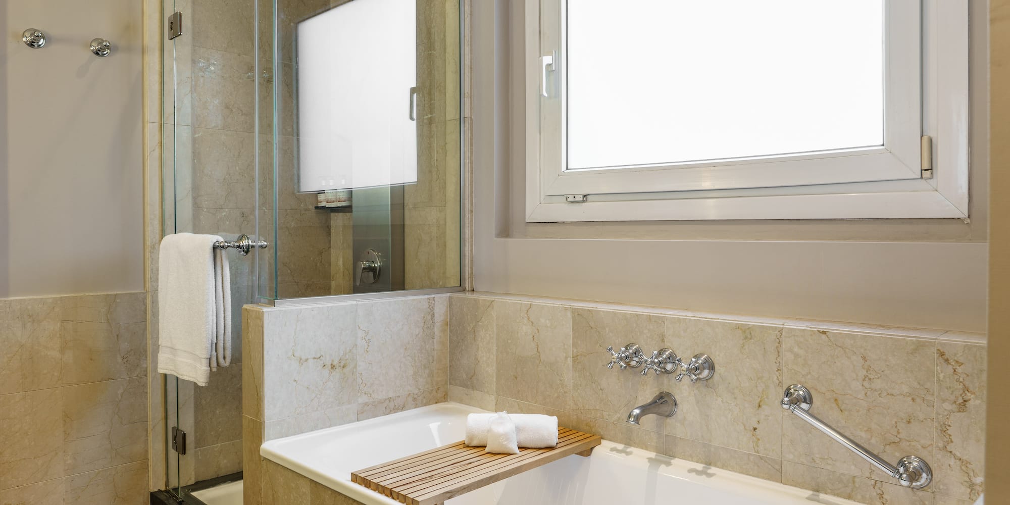 a bathtub and shower in a bathroom