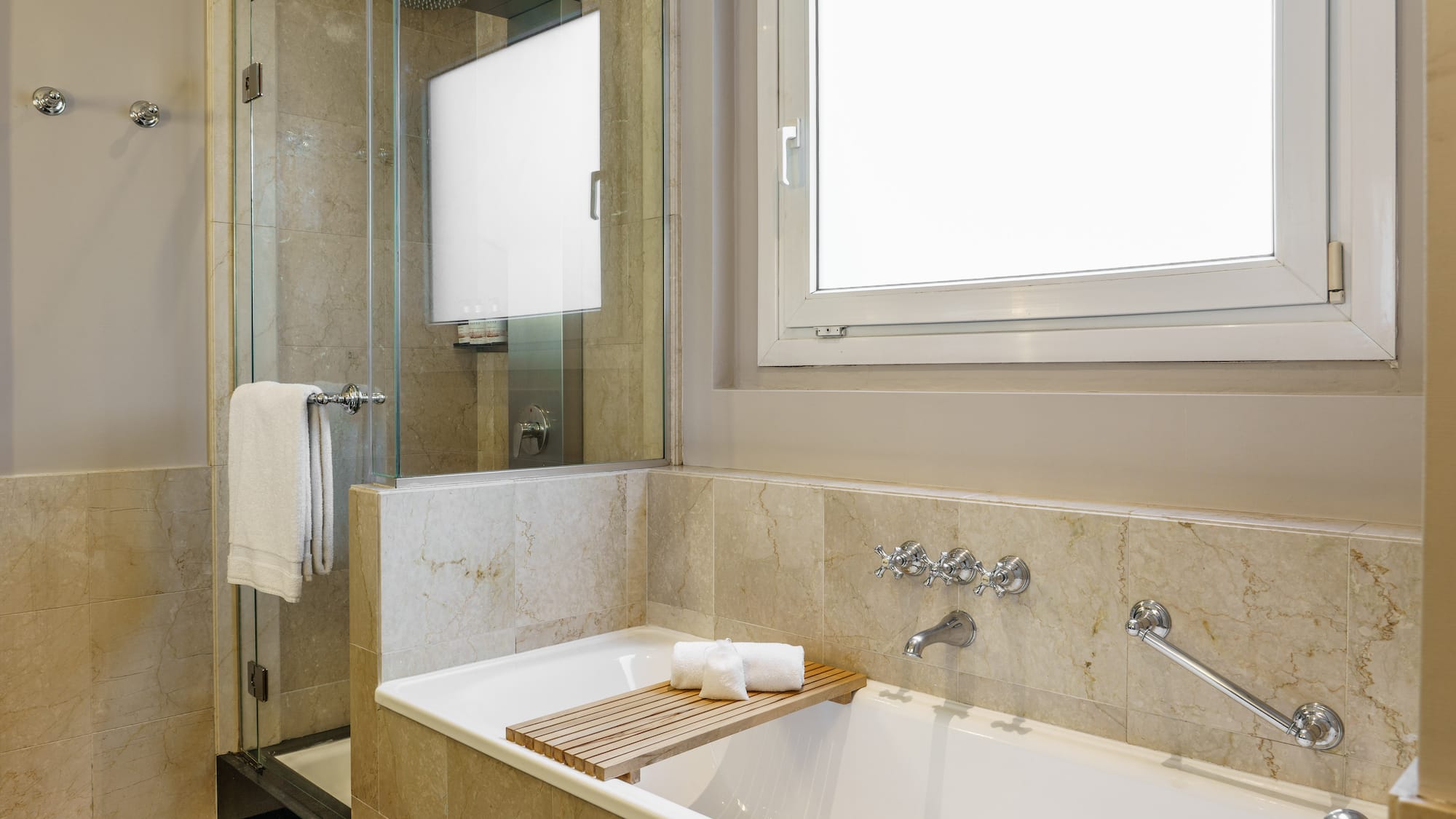 a bathtub and shower in a bathroom