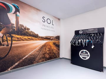 a bicycle rack with swingers and a picture of a road