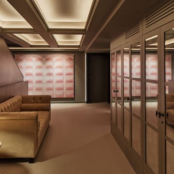 a room with a couch and glass doors