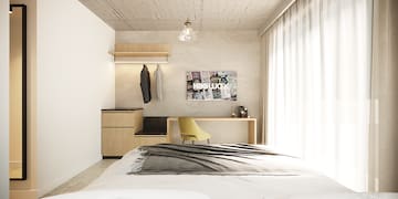a bedroom with a bed and a desk