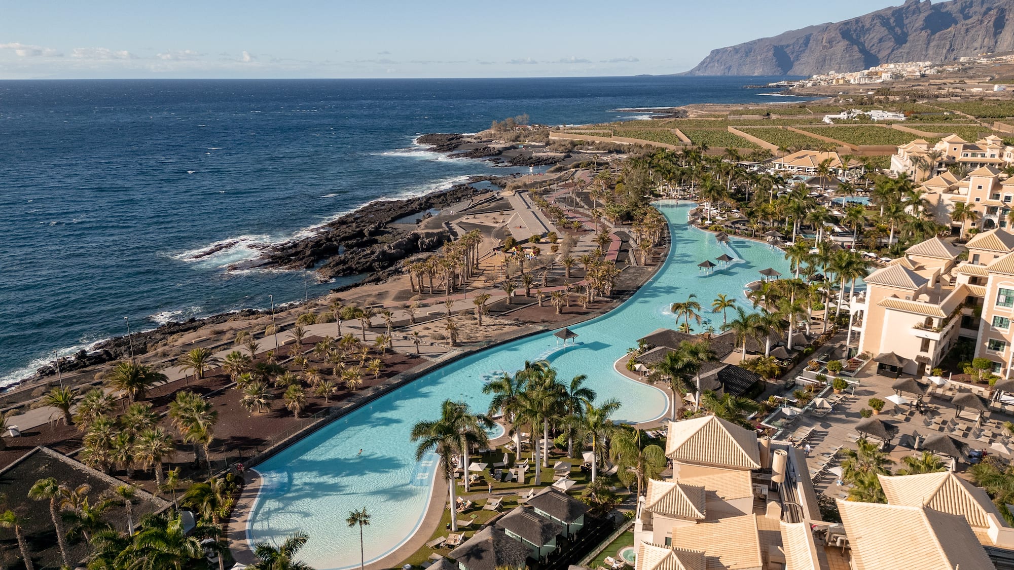 a swimming pool next to a body of water