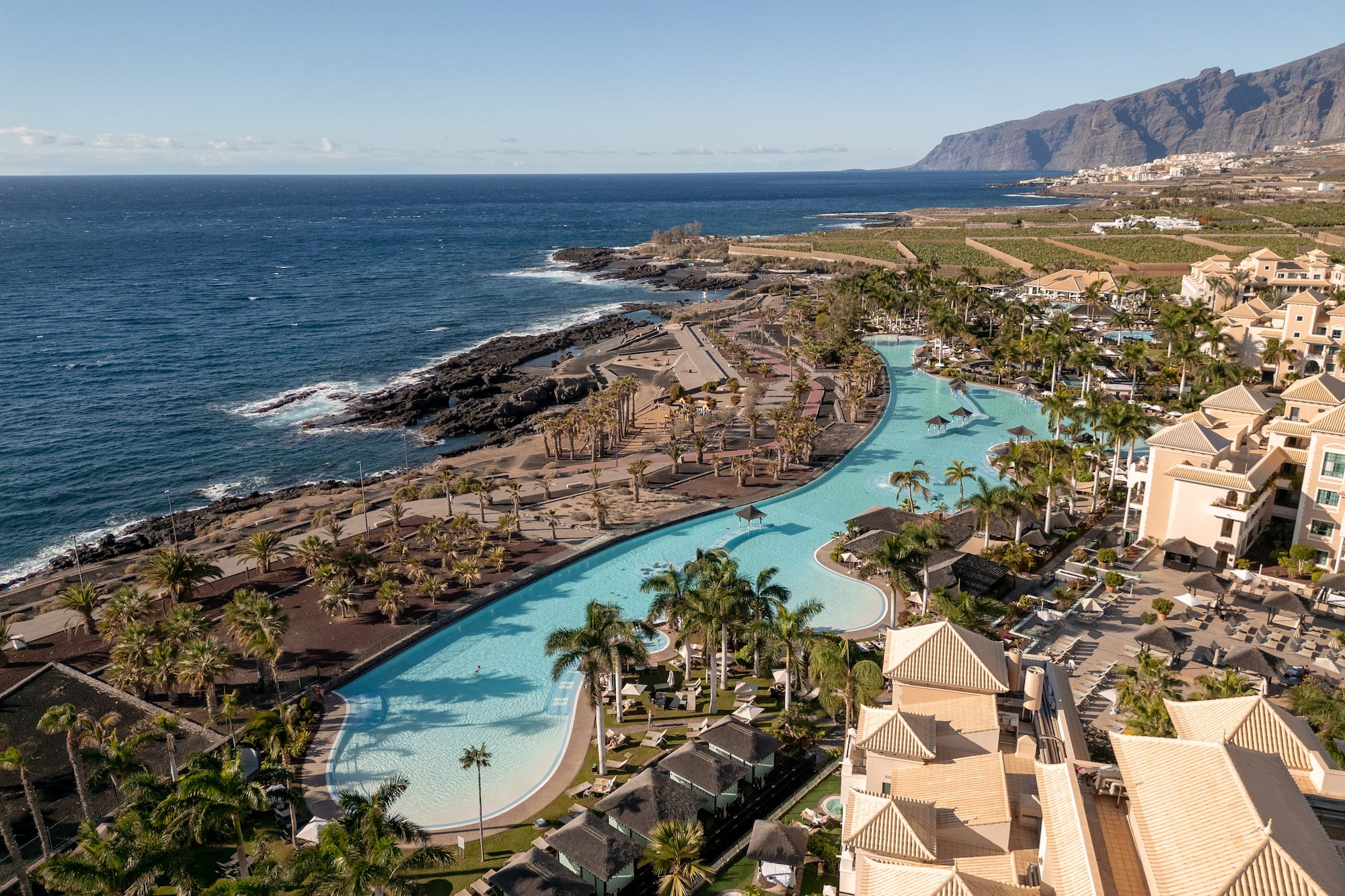 a swimming pool next to a body of water