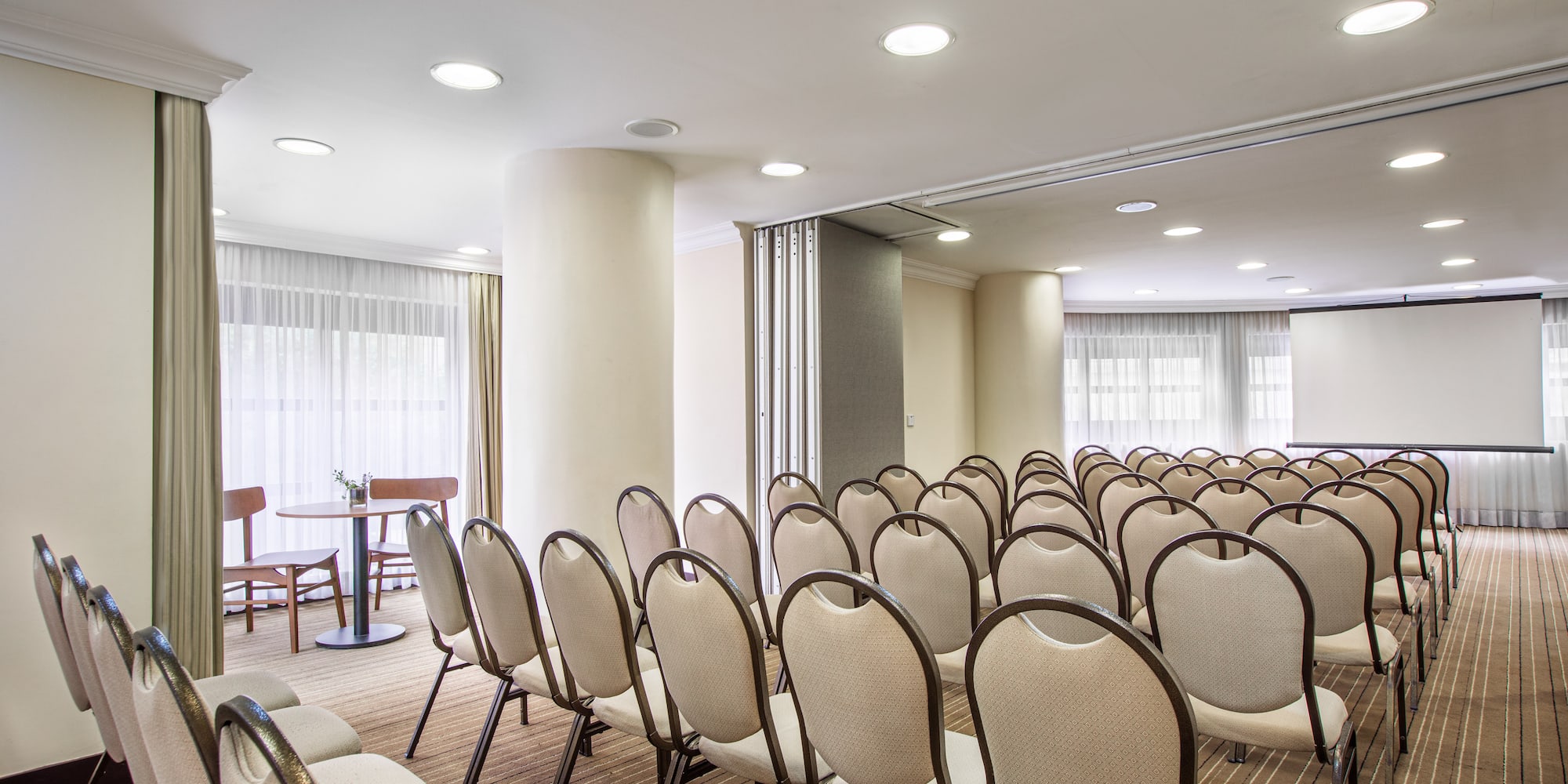 a room with chairs and tables