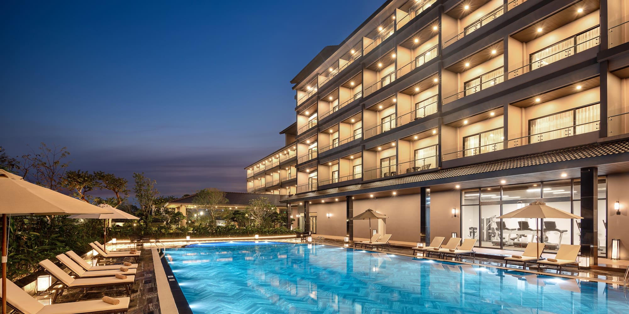 a swimming pool in front of a building