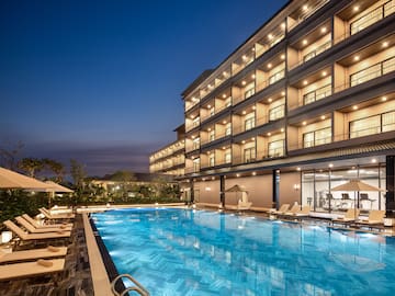 a swimming pool in front of a building
