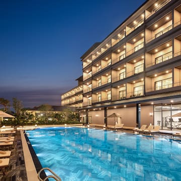a swimming pool in front of a building