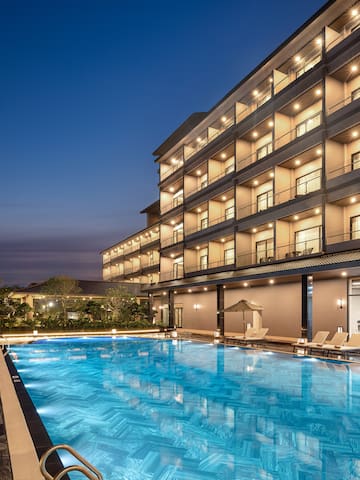 a swimming pool in front of a building