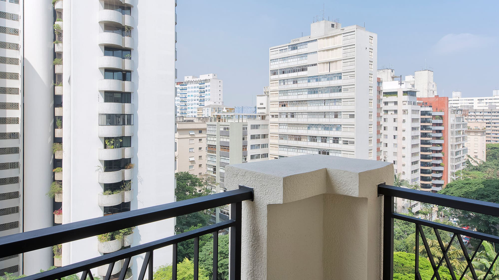a balcony with a view of a city