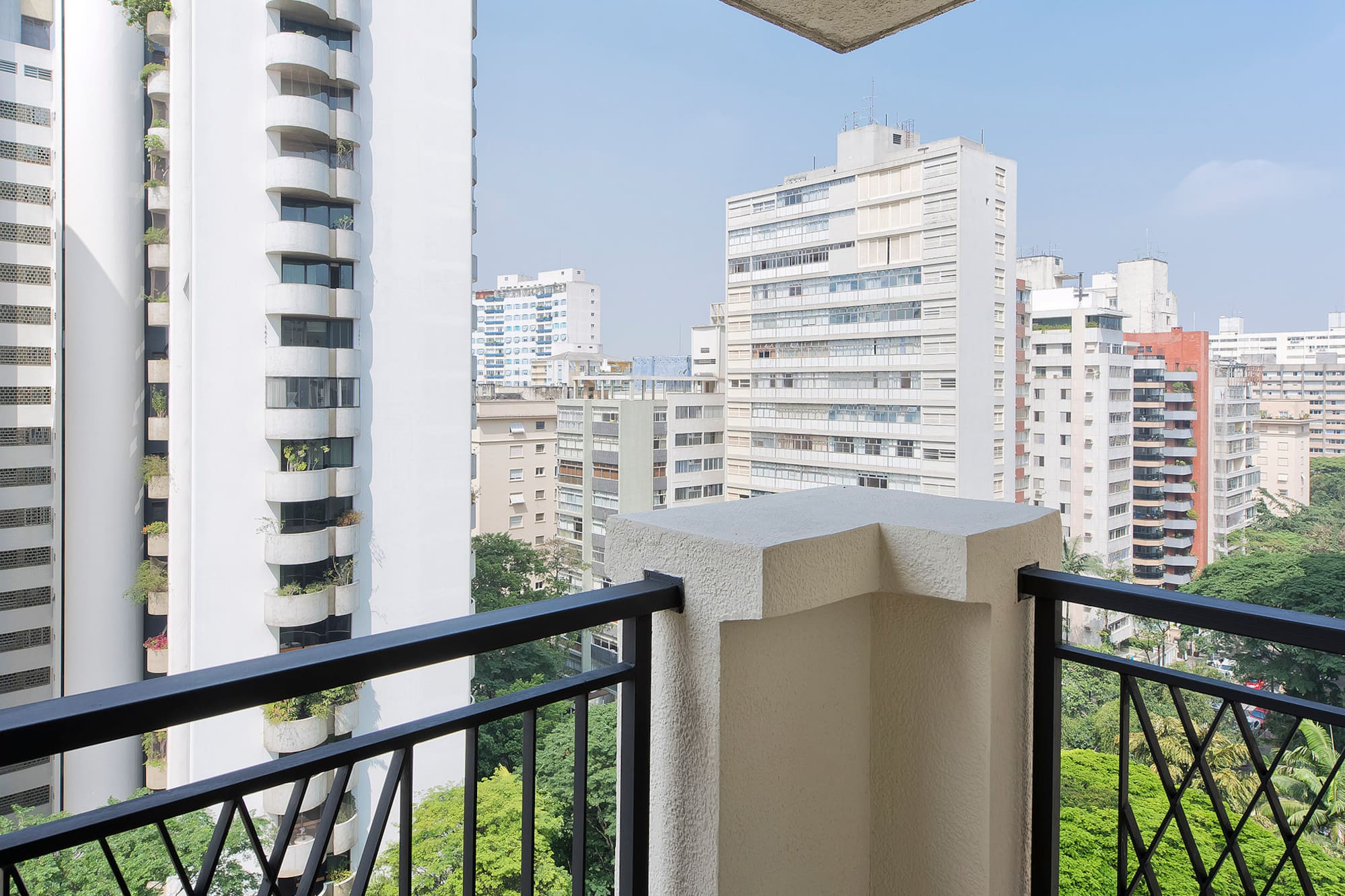 a balcony with a view of a city