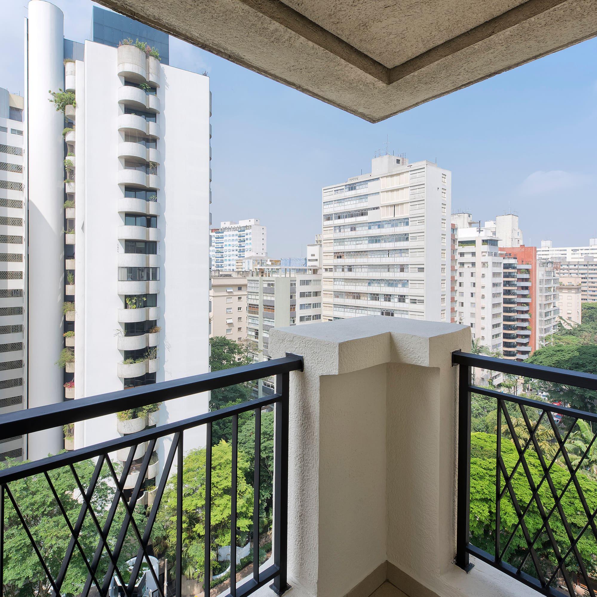 a balcony with a view of a city
