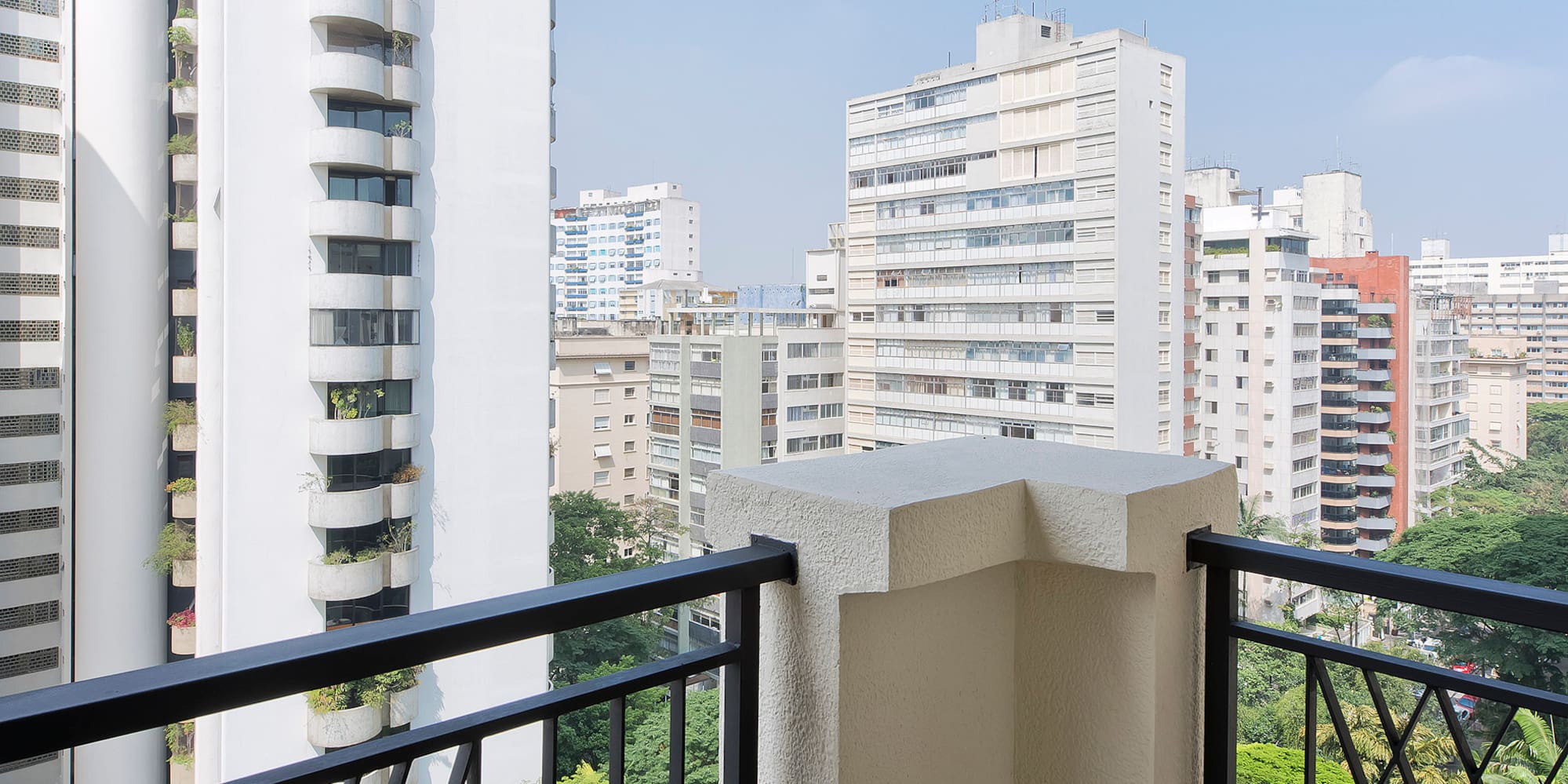 a balcony with a view of a city