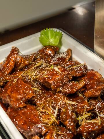 a plate of meat with sauce