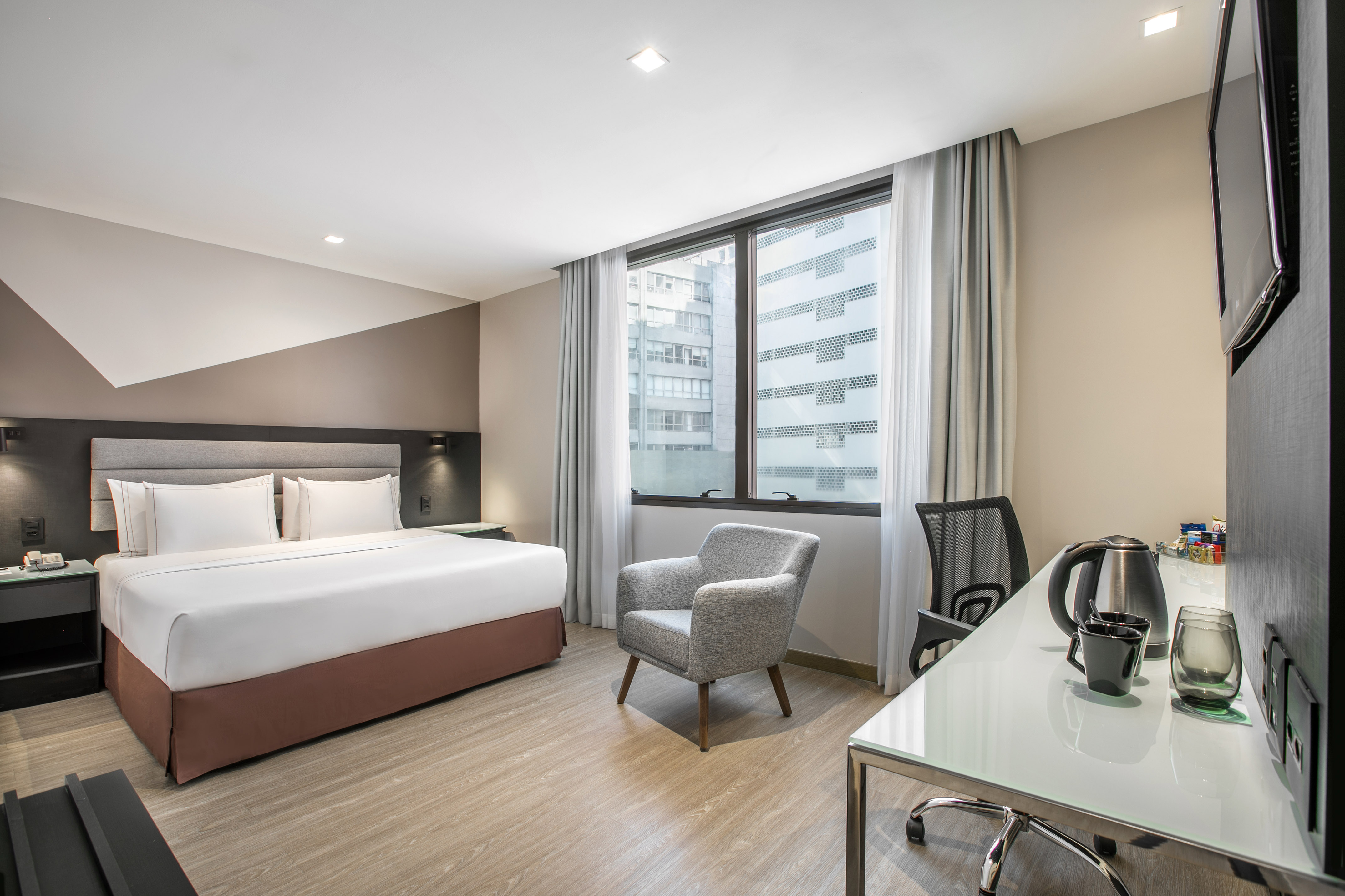 a room with a bed and a desk