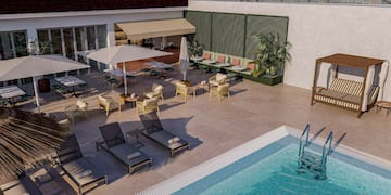 a pool with chairs and umbrellas