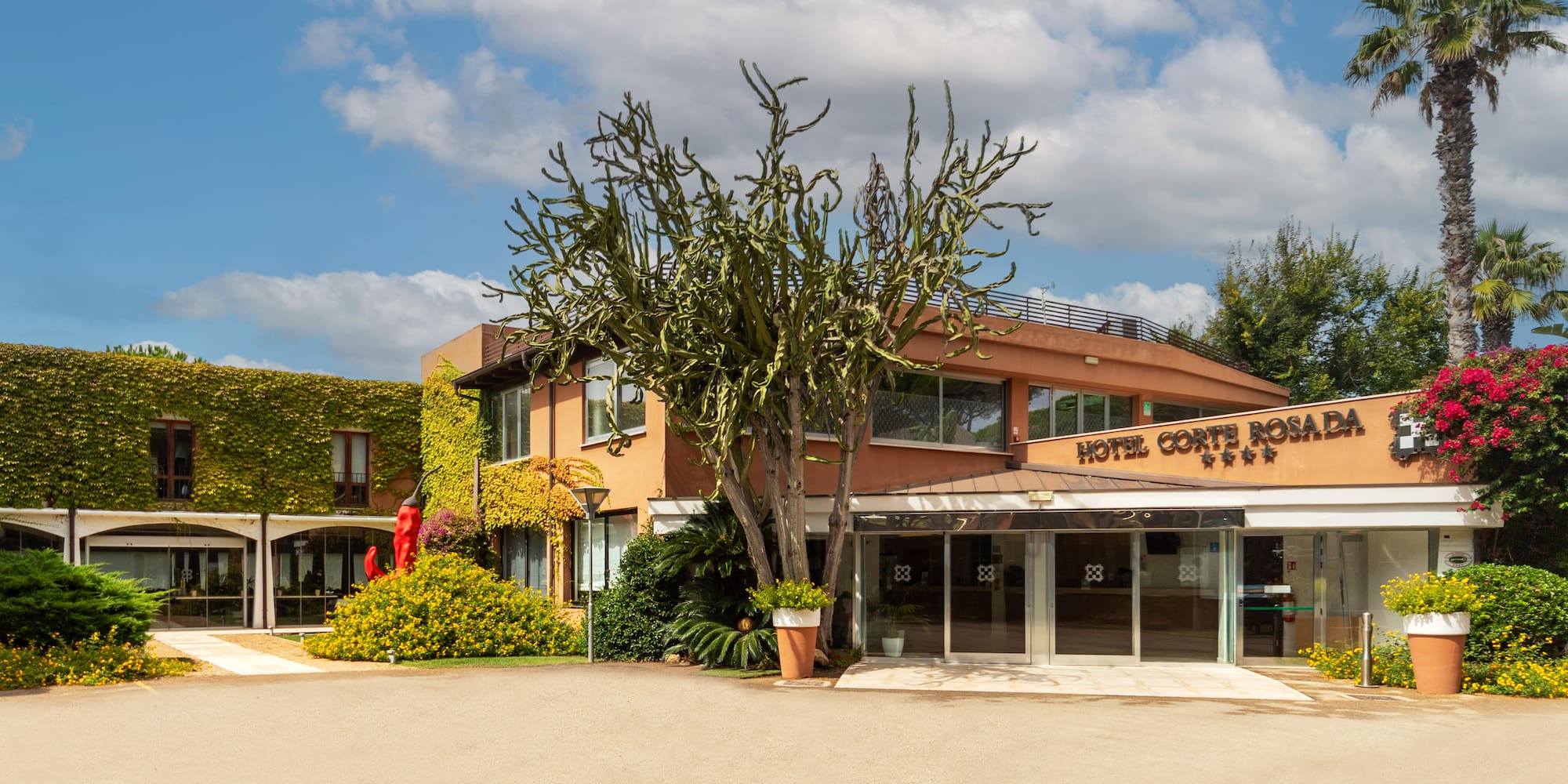 a building with a tree and a sign