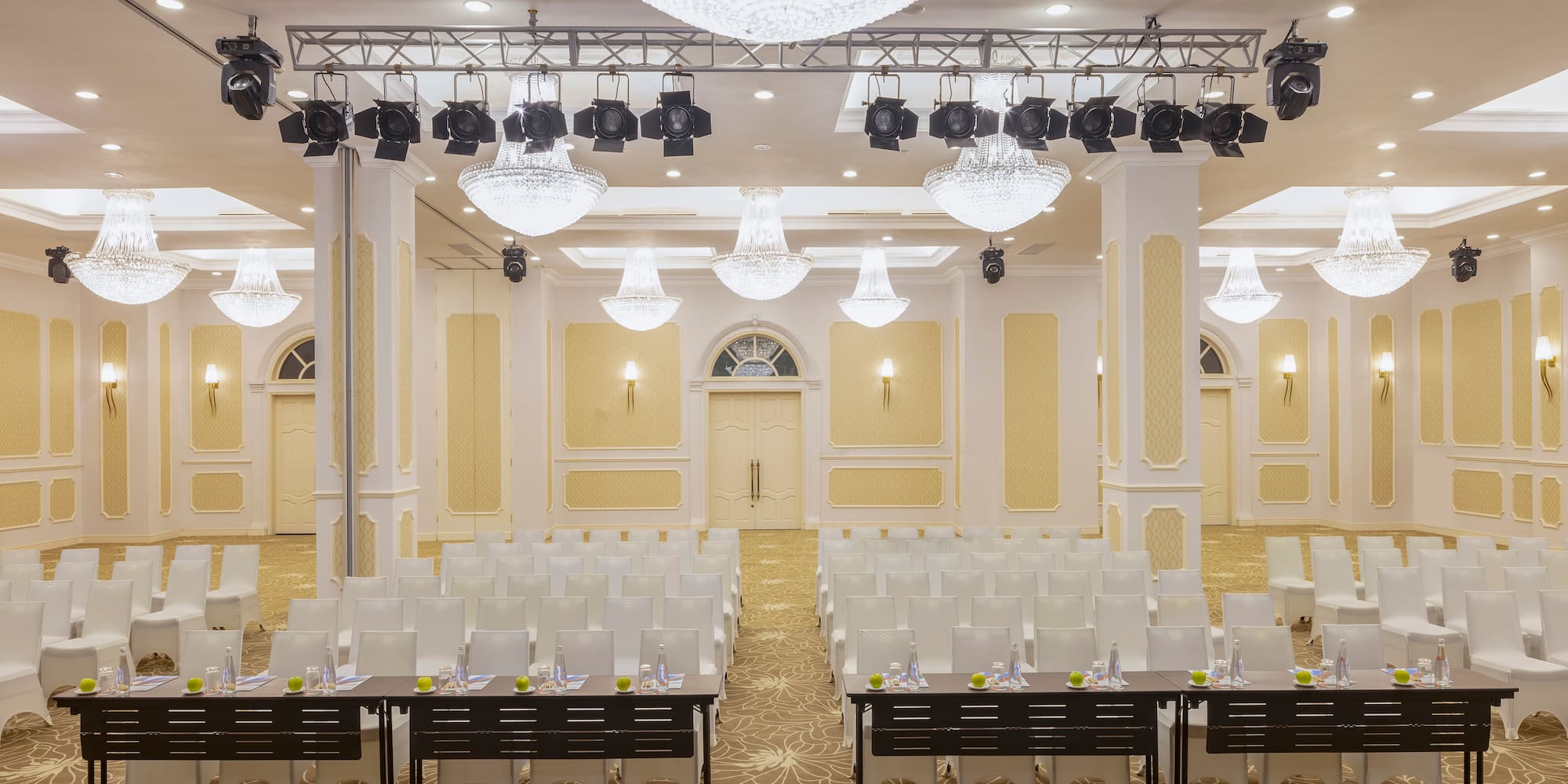 a room with chairs and lights