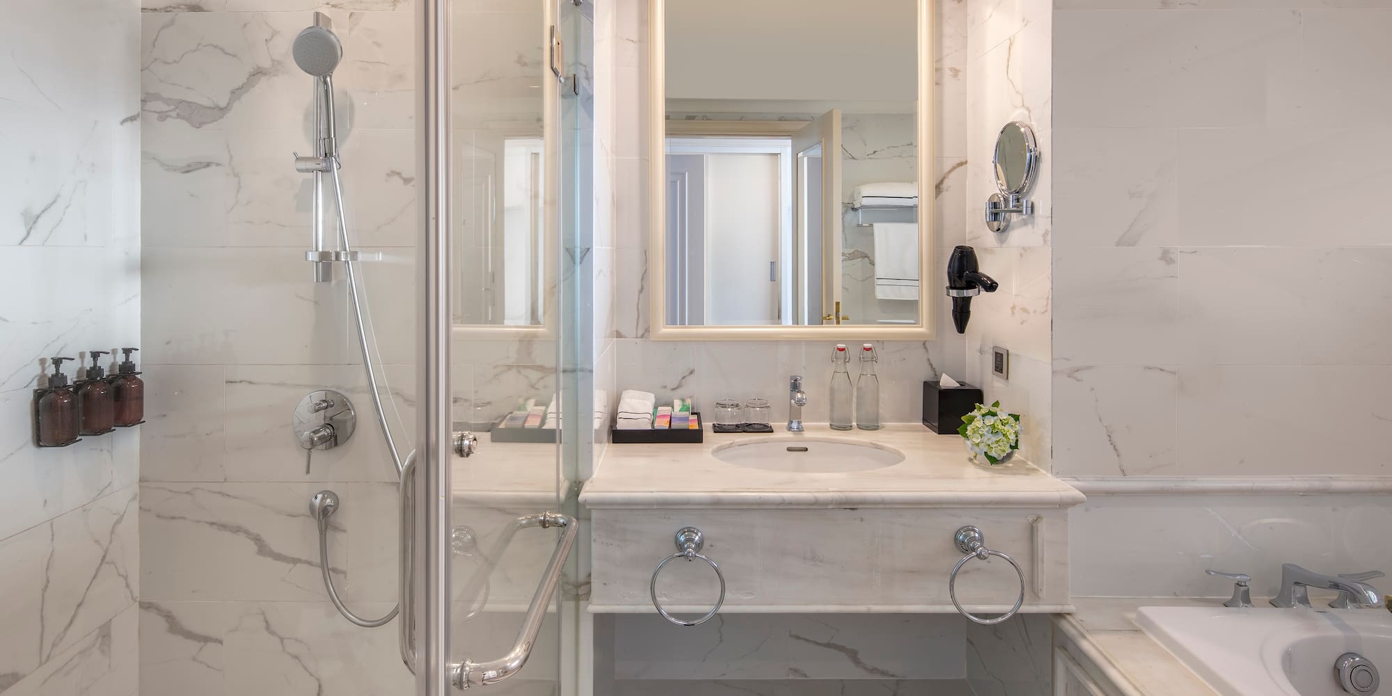 a bathroom with a shower and sink