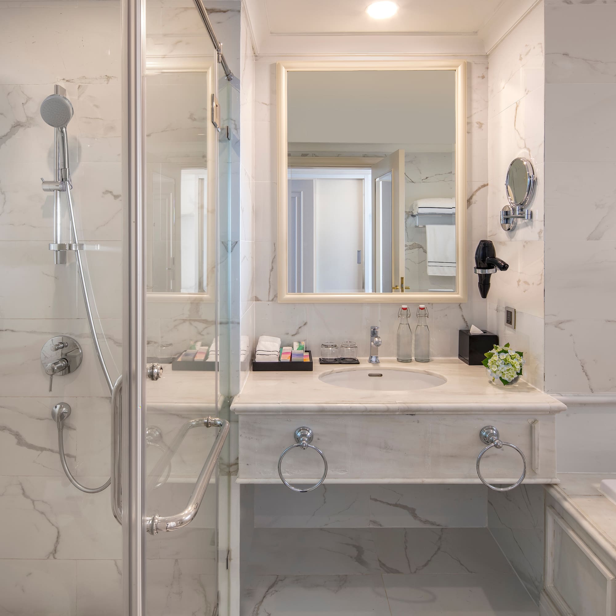 a bathroom with a shower and sink