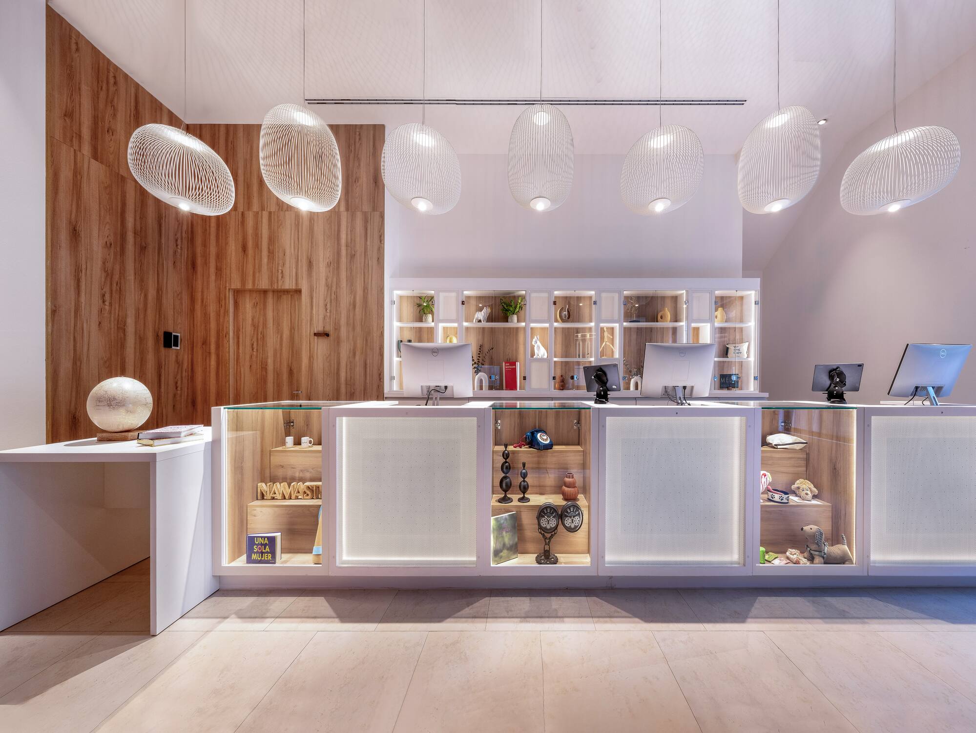 a reception desk with a counter and a desk with a desk and a desk with a desk and a desk with a desk and a desk with a desk and a desk with a desk and a desk