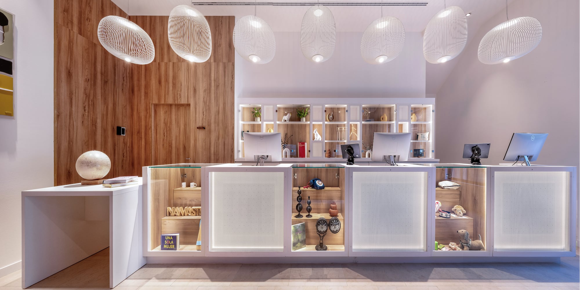 a reception desk with a counter and a desk with a desk and a desk with a desk and a desk with a desk and a desk with a desk and a desk with a desk and a desk