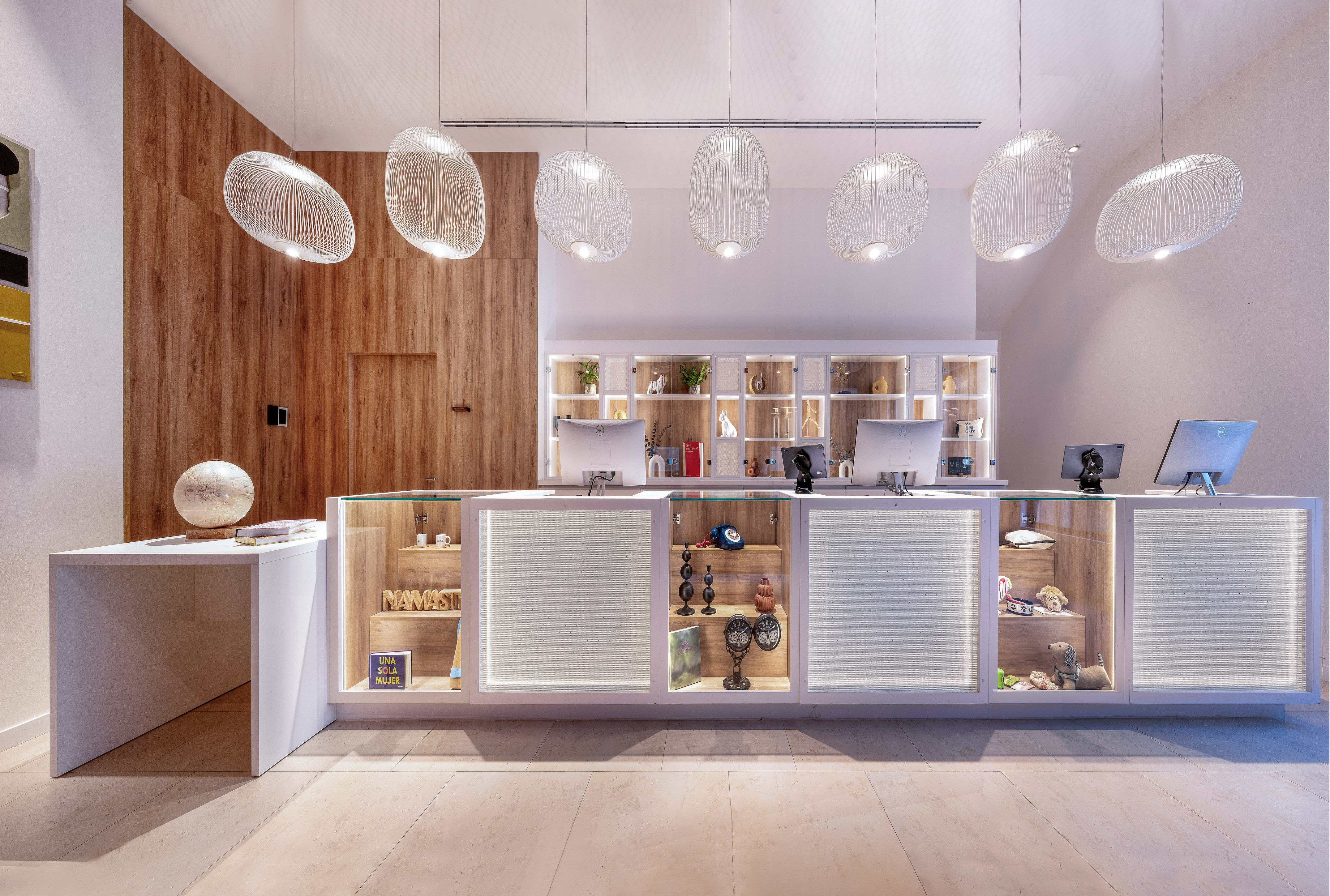 a reception desk with a counter and a desk with a desk and a desk with a desk and a desk with a desk and a desk with a desk and a desk with a desk and a desk