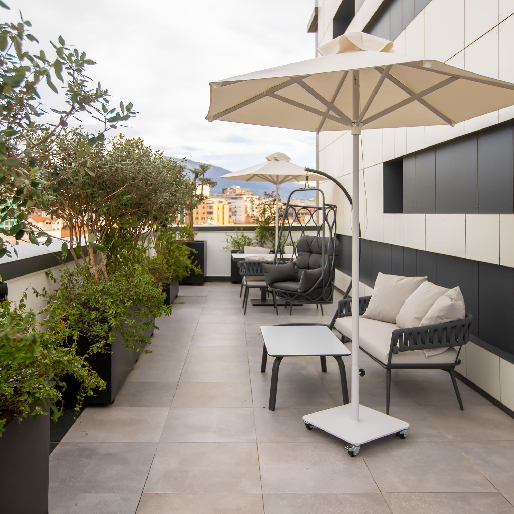 a patio with chairs and umbrellas