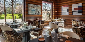 a restaurant with tables and chairs
