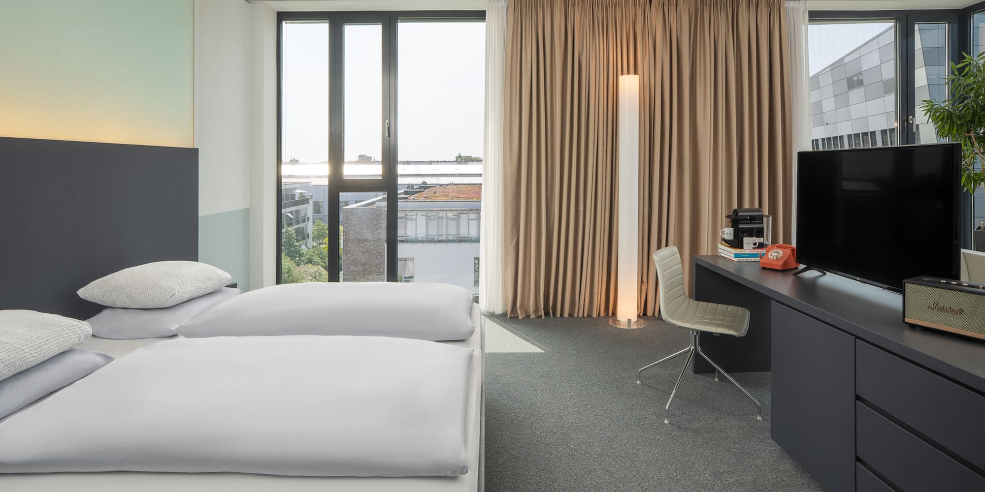 a room with a bed and a desk