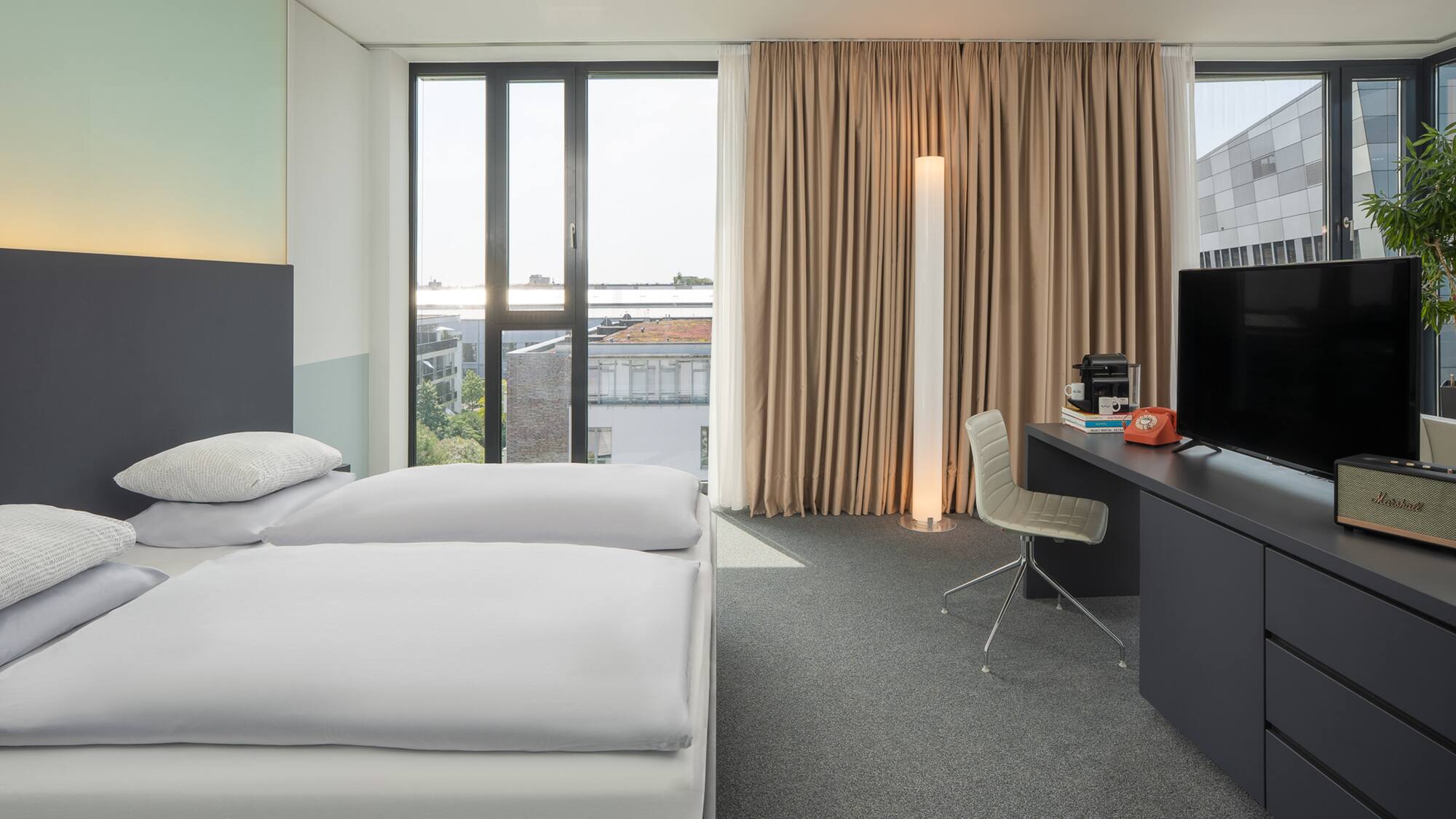 a room with a bed and a desk