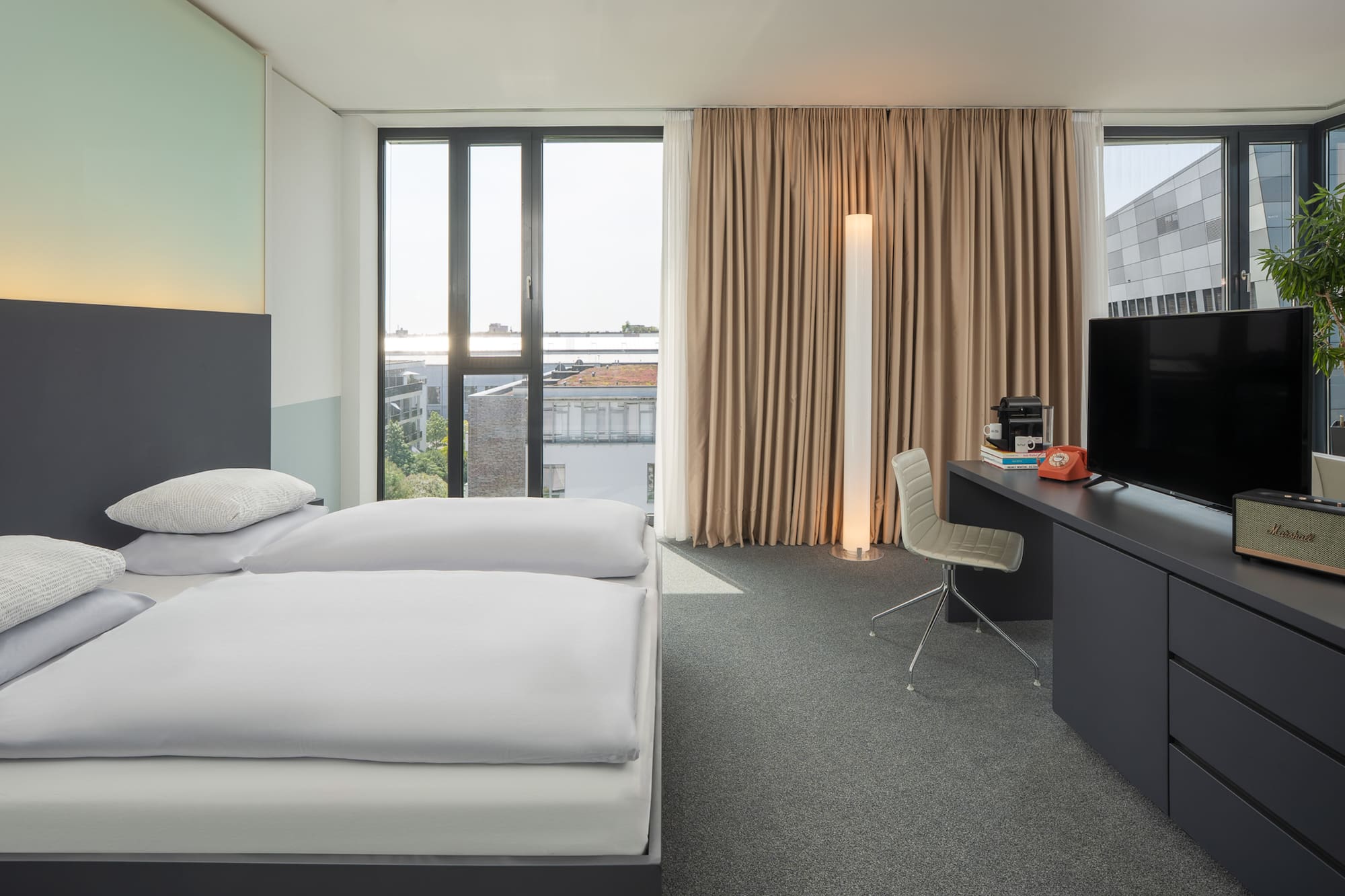 a room with a bed and a desk