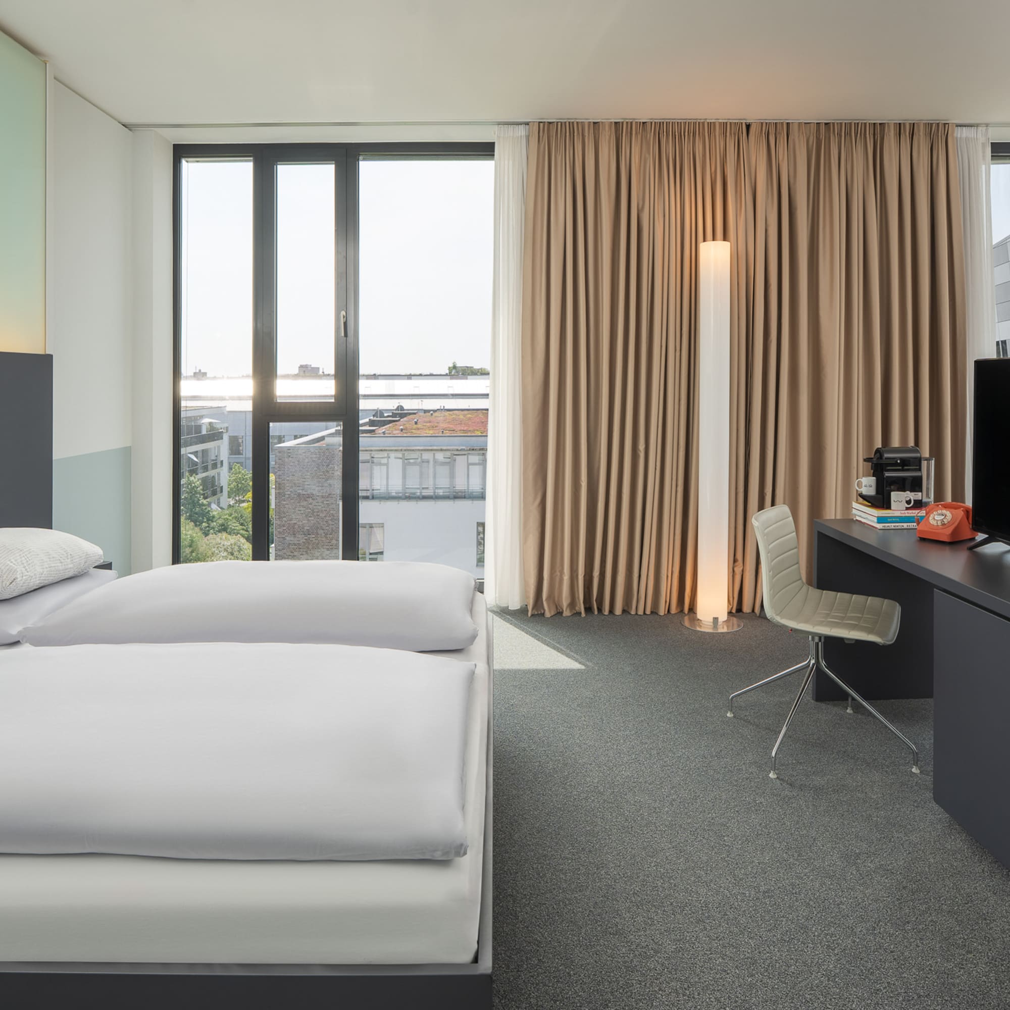 a room with a bed and a desk