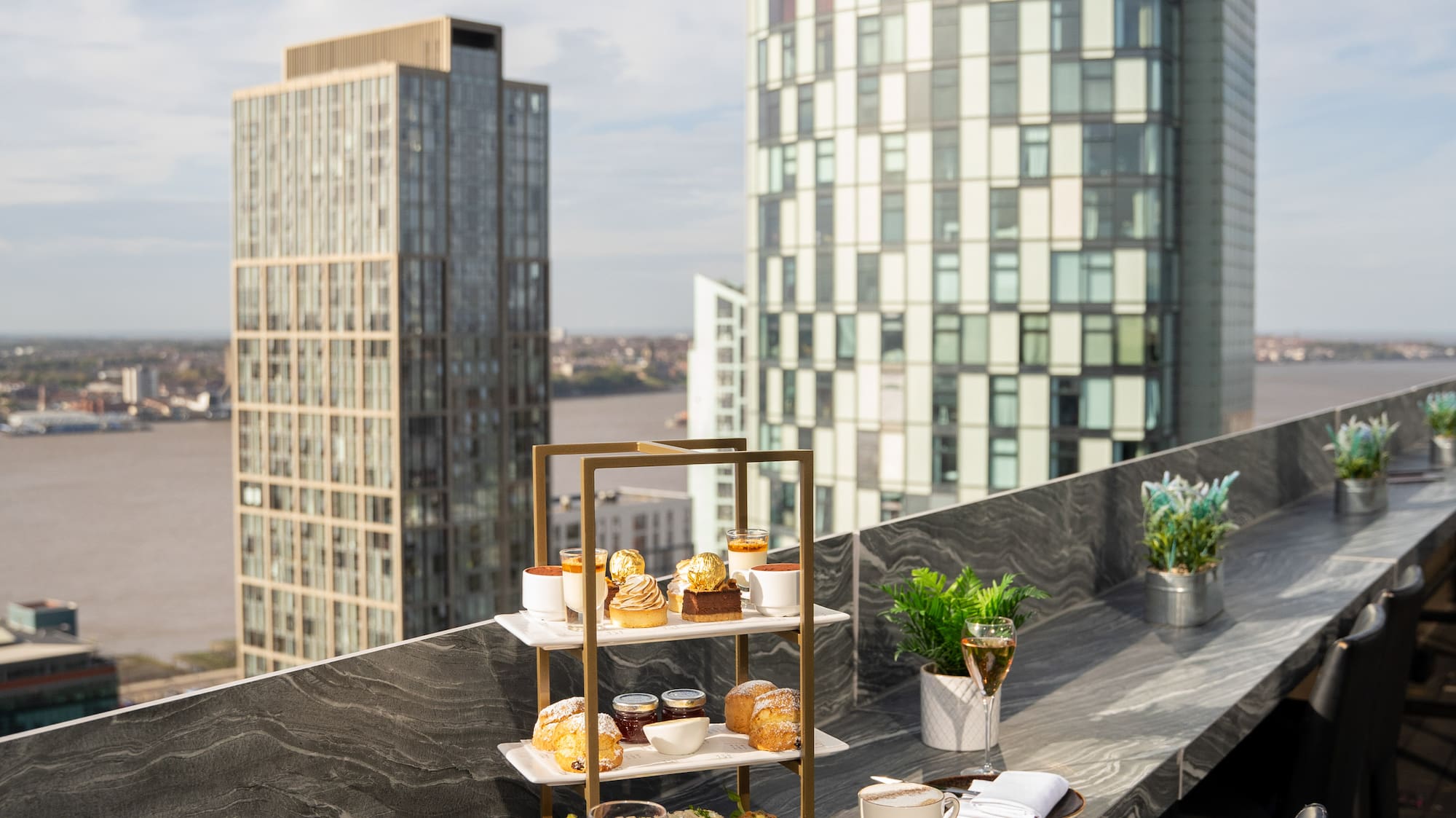 a table with food on it and a glass of wine on it