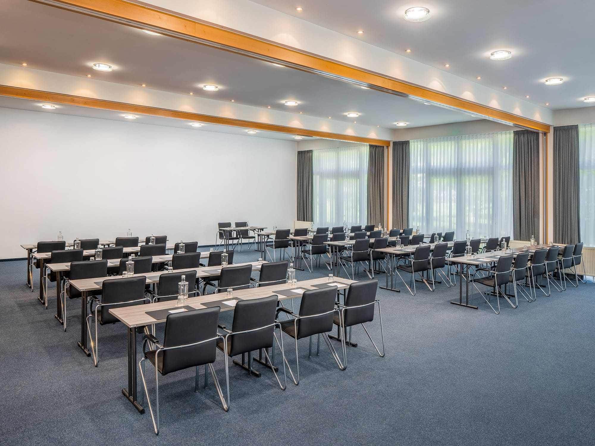 a room with many chairs and tables