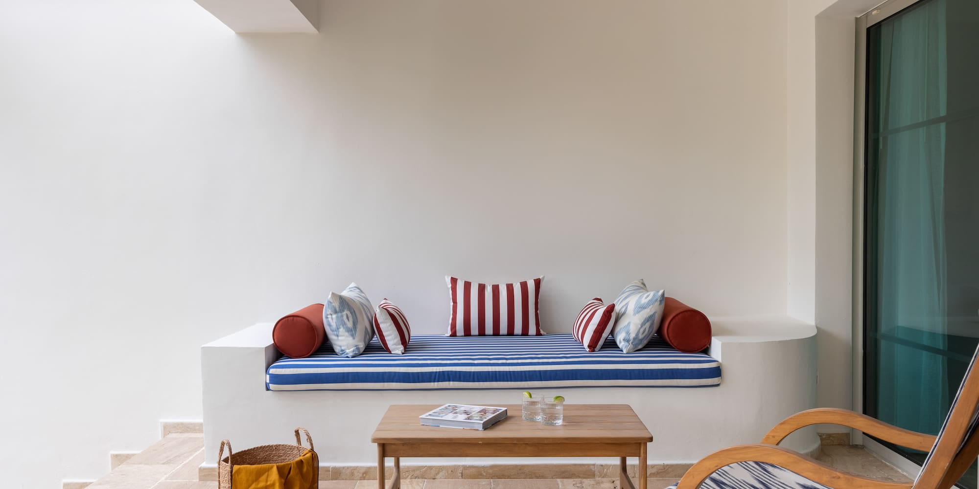 a couch with pillows and a coffee table in a room