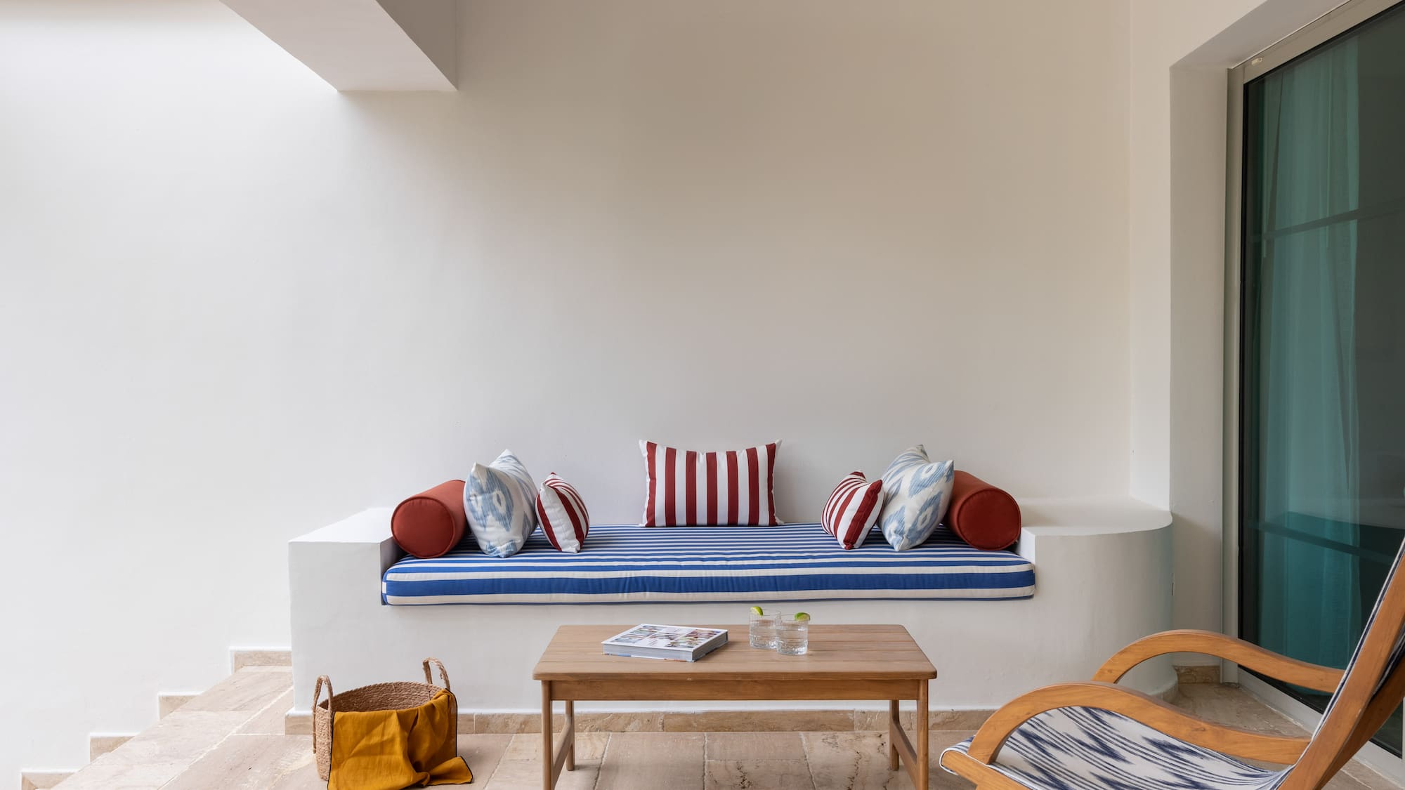 a couch with pillows and a coffee table in a room