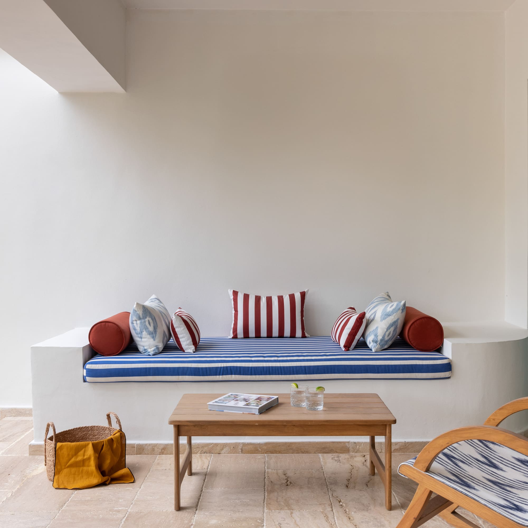 a couch with pillows and a coffee table in a room