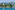 a body of water with buildings and trees