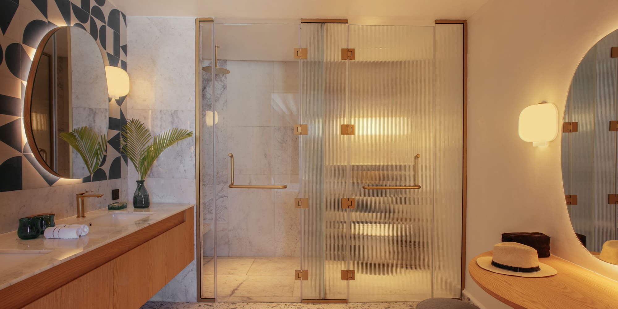 a bathroom with a glass shower door