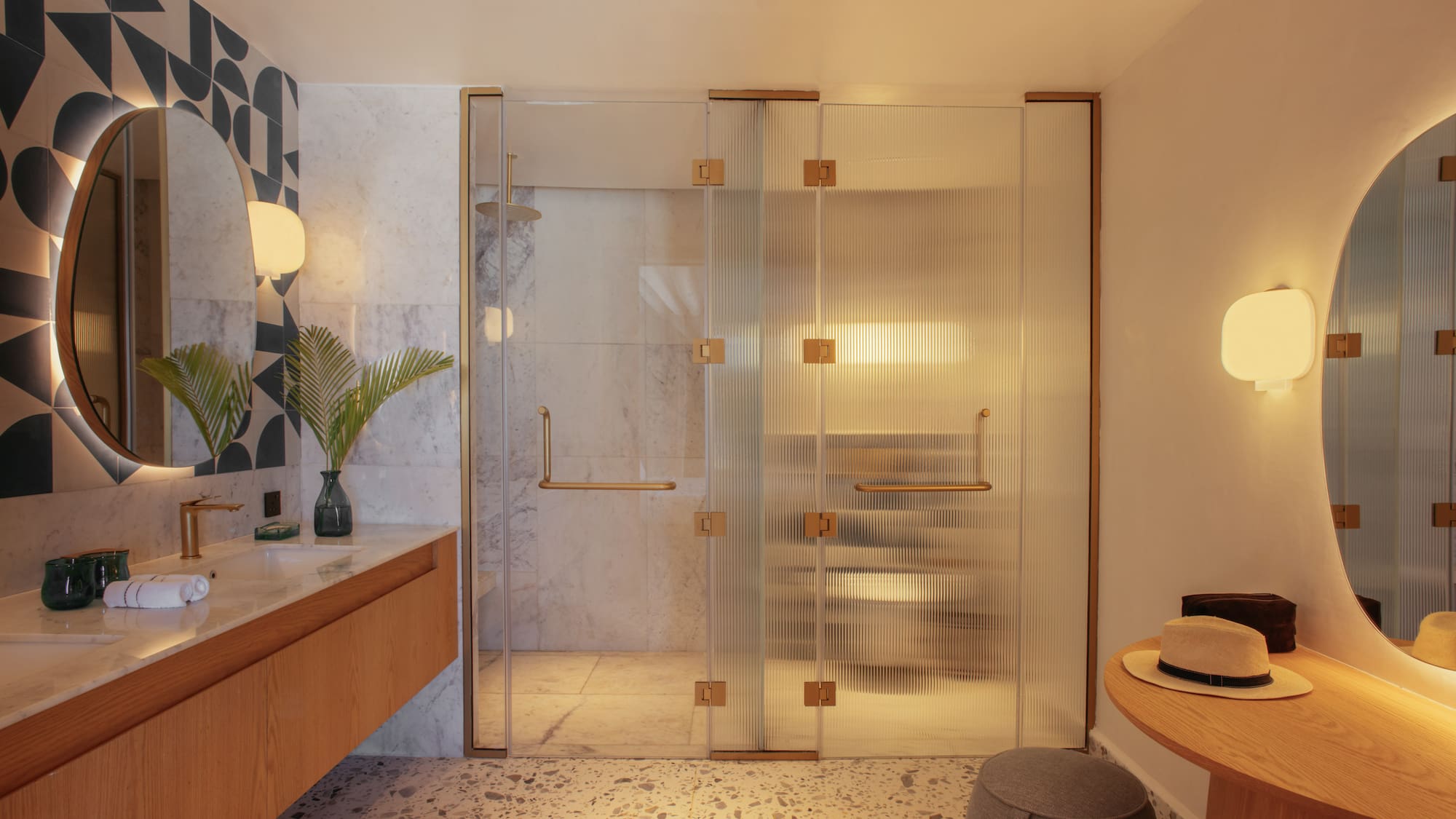 a bathroom with a glass shower door
