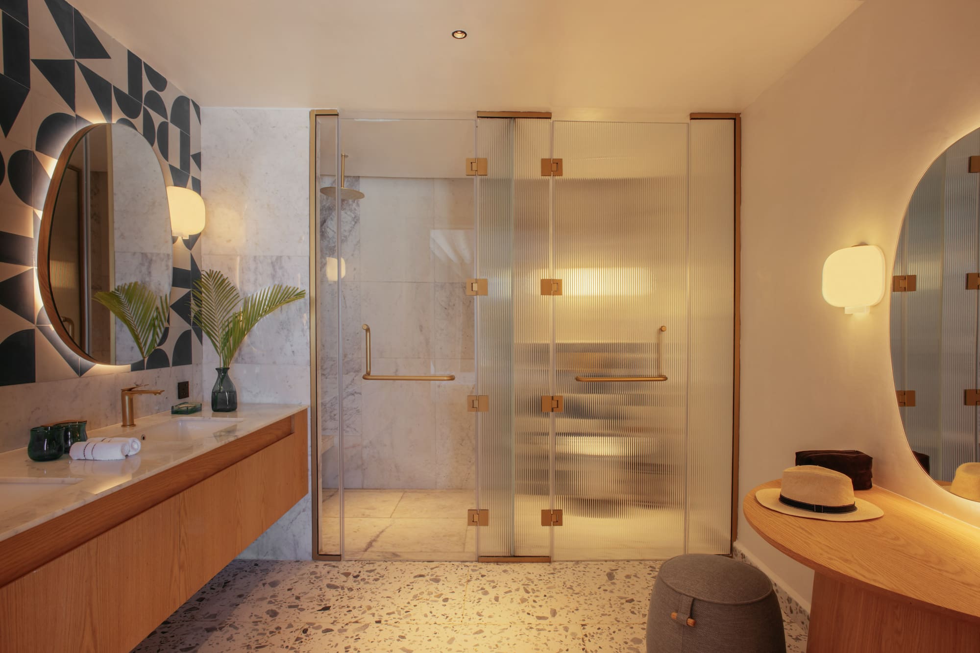 a bathroom with a glass shower door