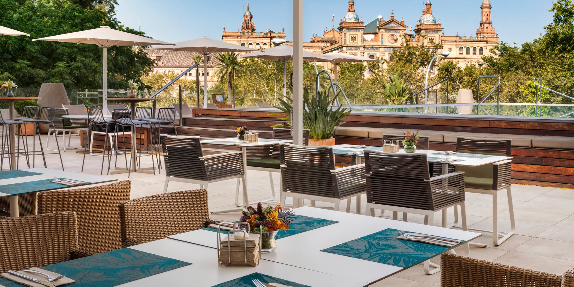 a patio with tables and chairs