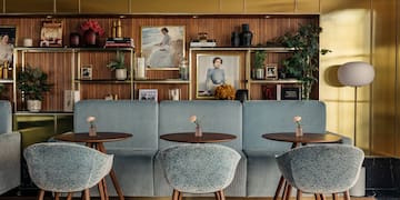 a room with a couch and tables