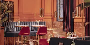 a restaurant with tables and chairs